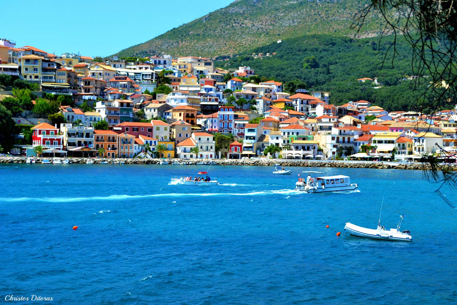 A scenic view of Parga, a picturesque town with colorful buildings nestled by the sea.